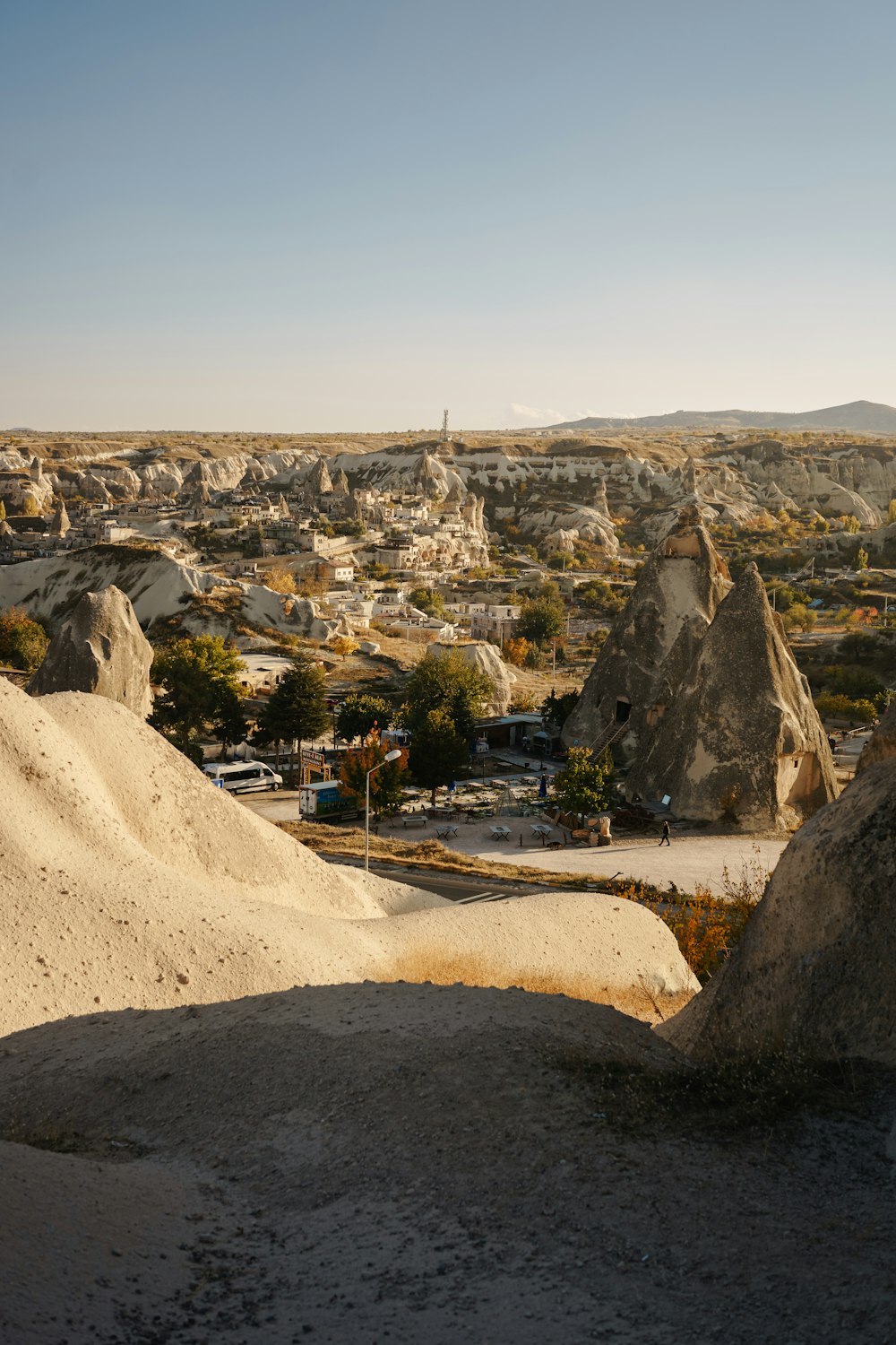 a rocky landscape with a road and trees