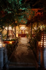 Evening shot of the development’s pathway lined with soft garden lighting leading to front doors.