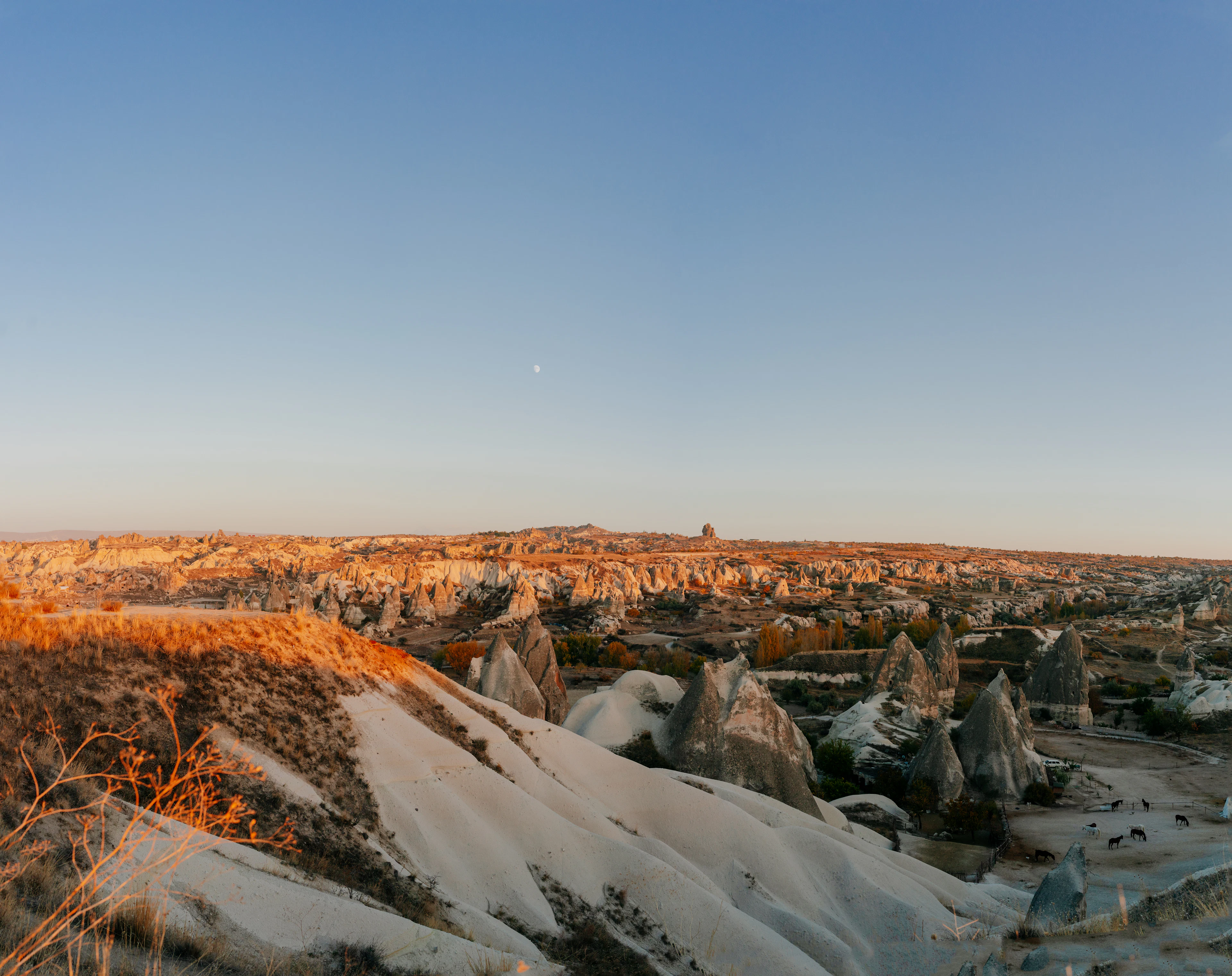 First morning light on the tuff ridges and rock cones near Göreme, Cappadocia