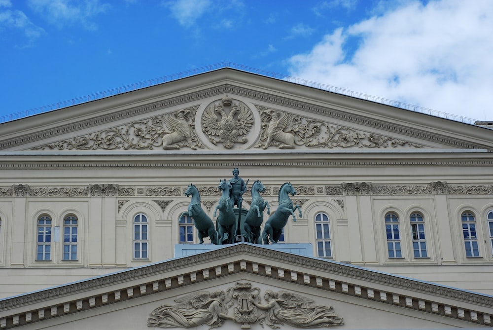 a building with statues in front of it