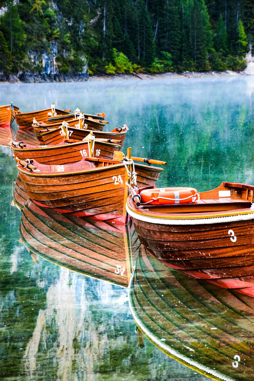 a group of boats sit on the water