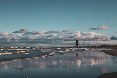 a body of water with a city in the distance