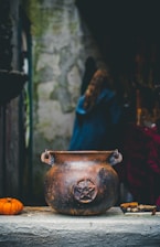 a vase with a face painted on it
