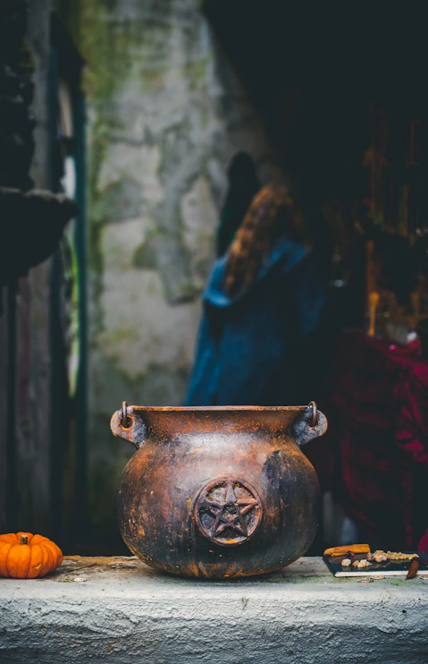 a vase with a face painted on it