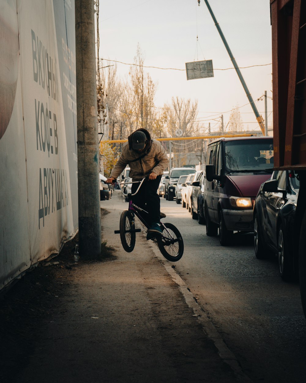 a person riding a bicycle down a street