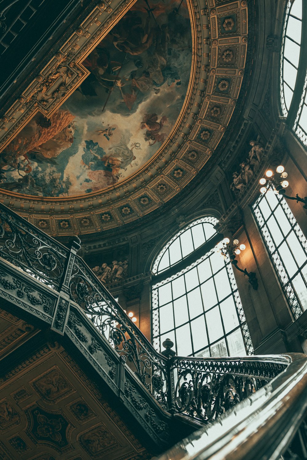 a large domed ceiling with a large arched window