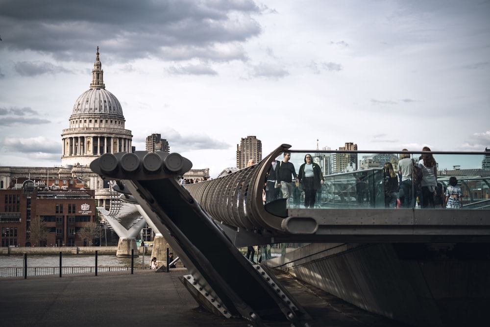 a group of people on a bridge