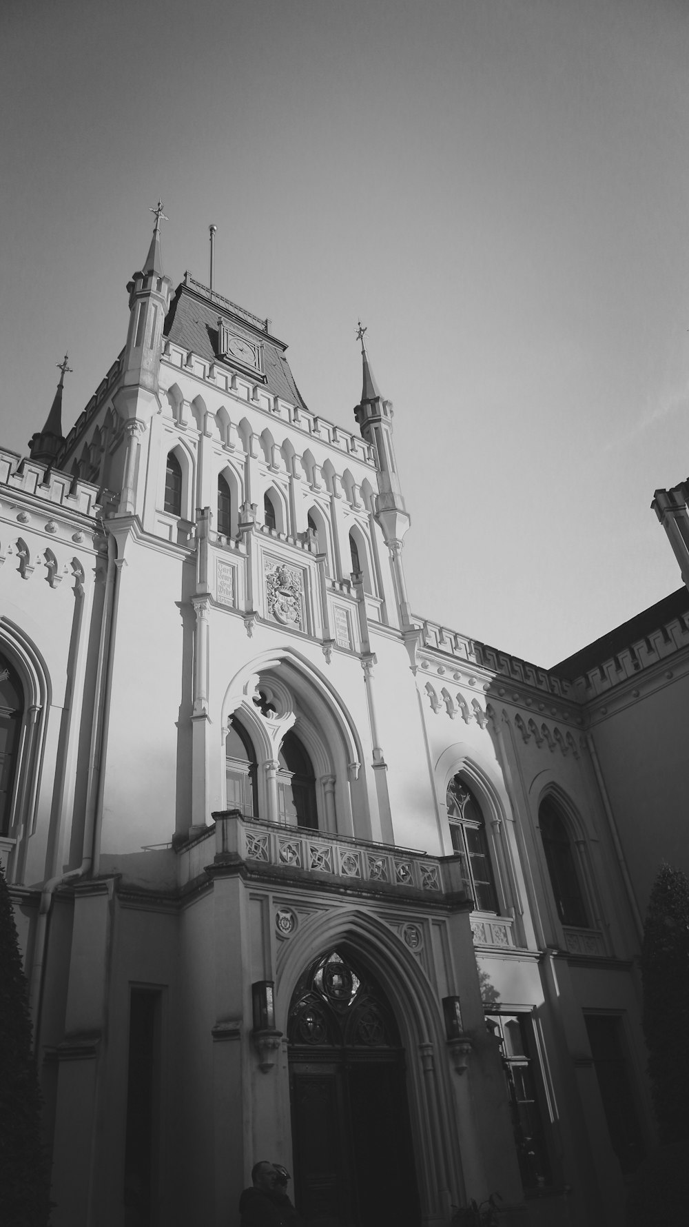 a large white building with a large arched doorway