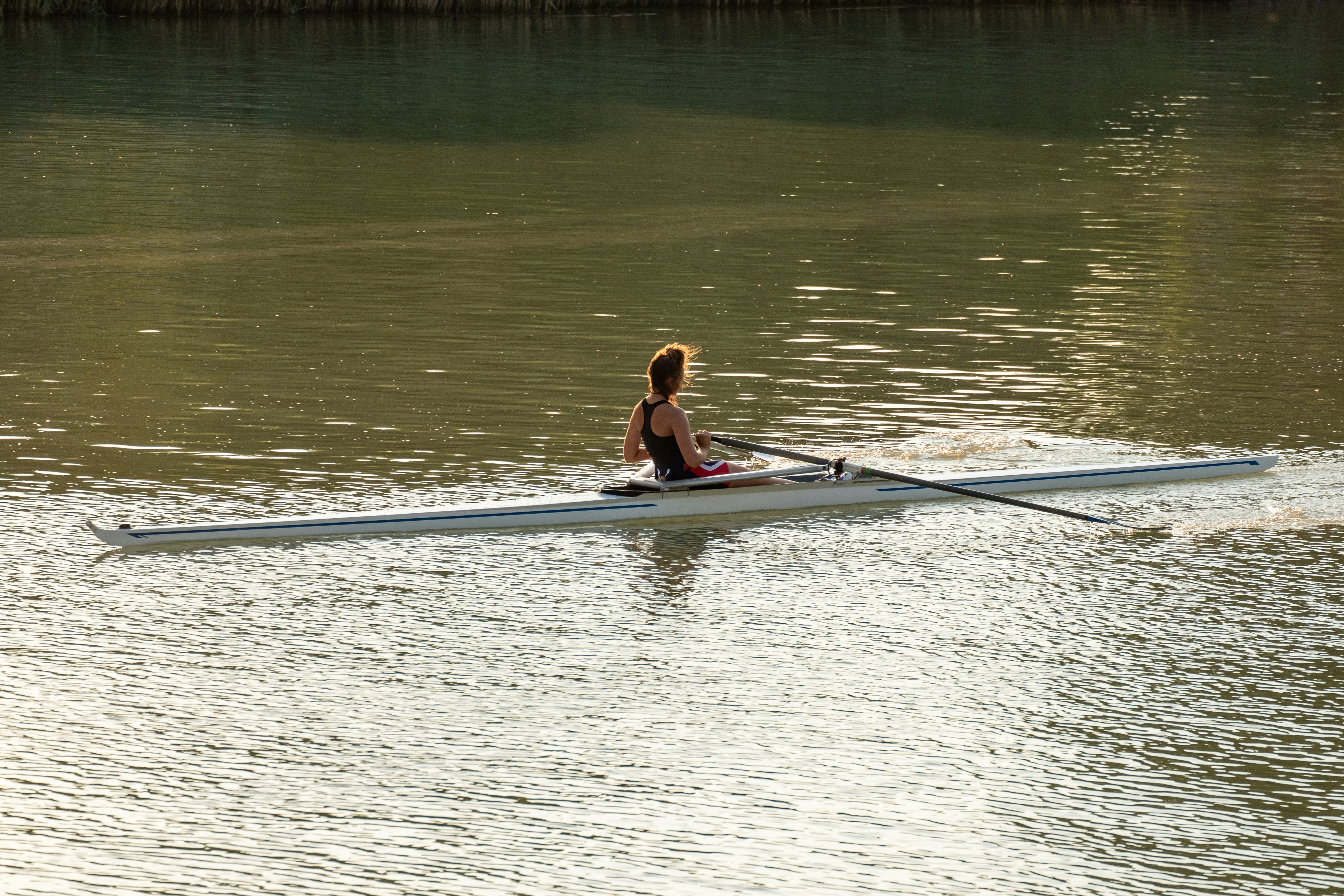 a person sitting on a paddle board