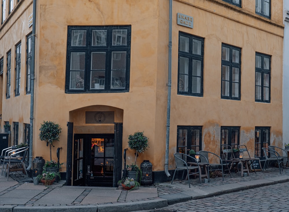 a building with tables and chairs outside