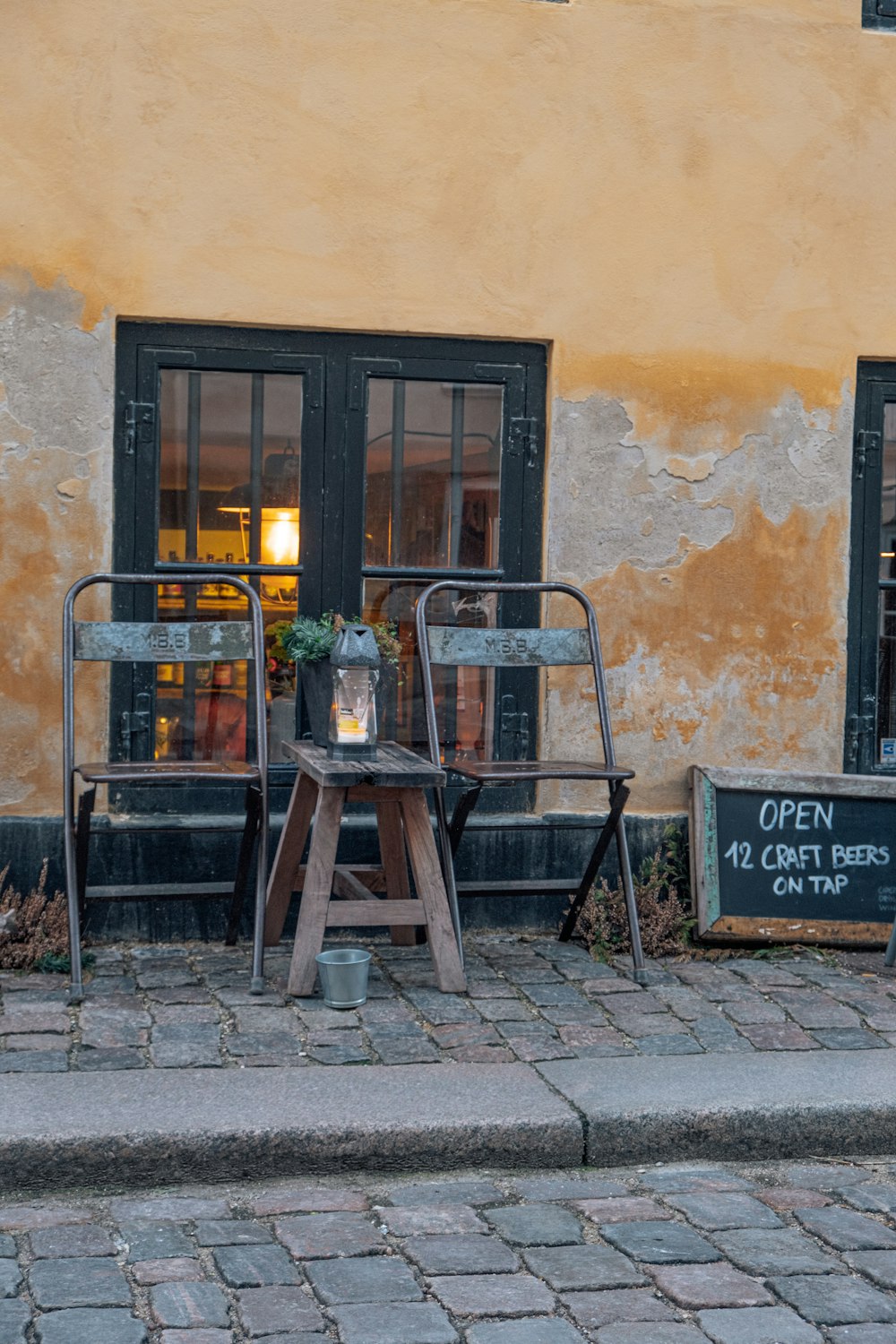 a chair and table outside a building