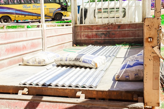 A delivery truck loaded with various construction materials ready for shipment.