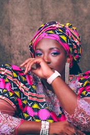 Model wearing a stylish outfit blending traditional African motifs with modern design.