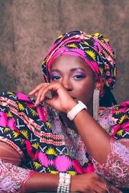 Model wearing a stylish outfit blending traditional African motifs with modern design.