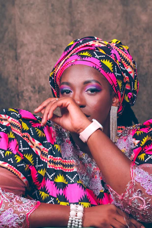 A young woman from the diaspora wearing a stylish outfit combining contemporary design with ancestral prints.