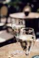 two glasses of champagne on a table
