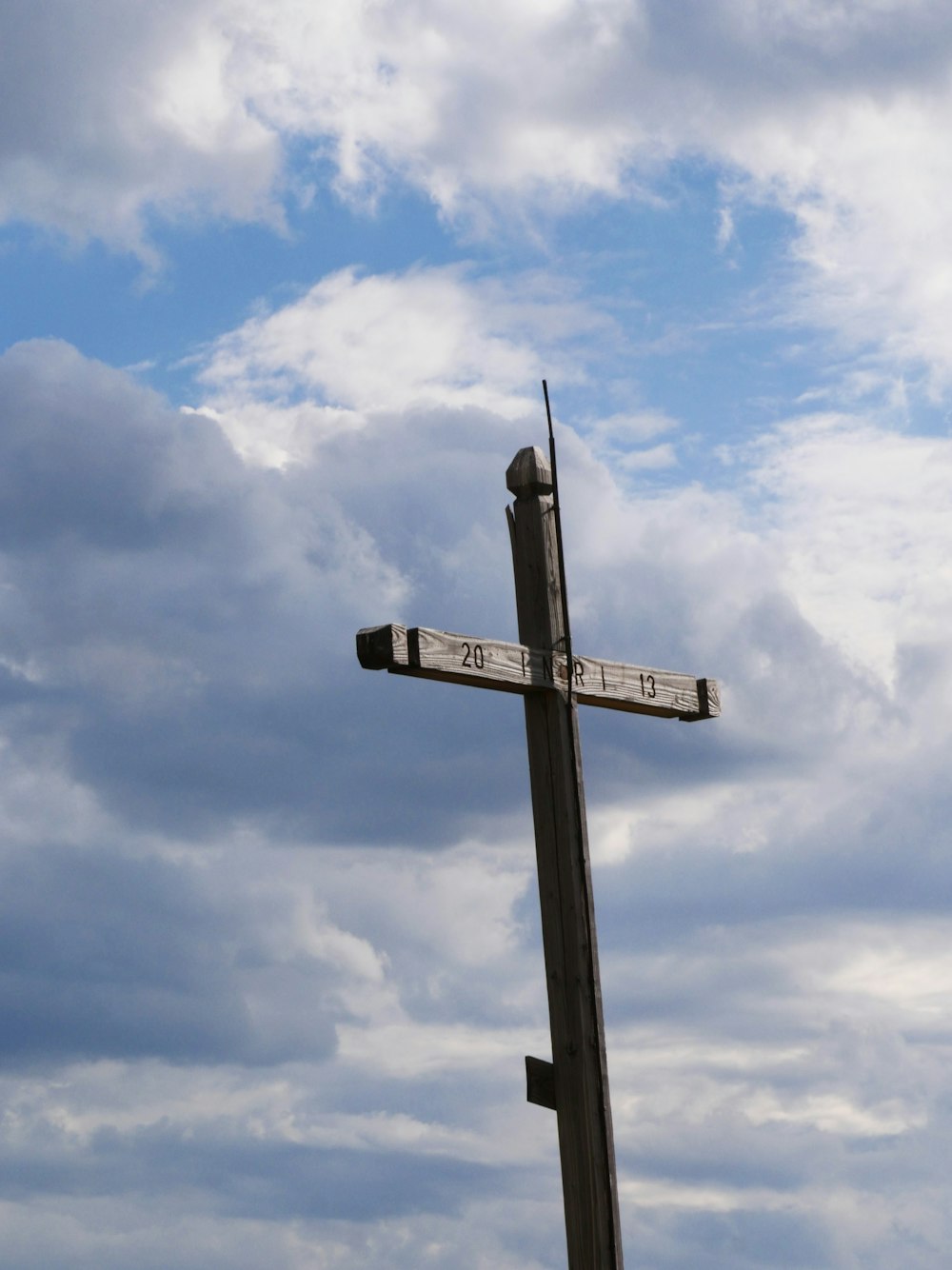 a cross with a sign on it