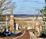 a road with cars and buildings along it