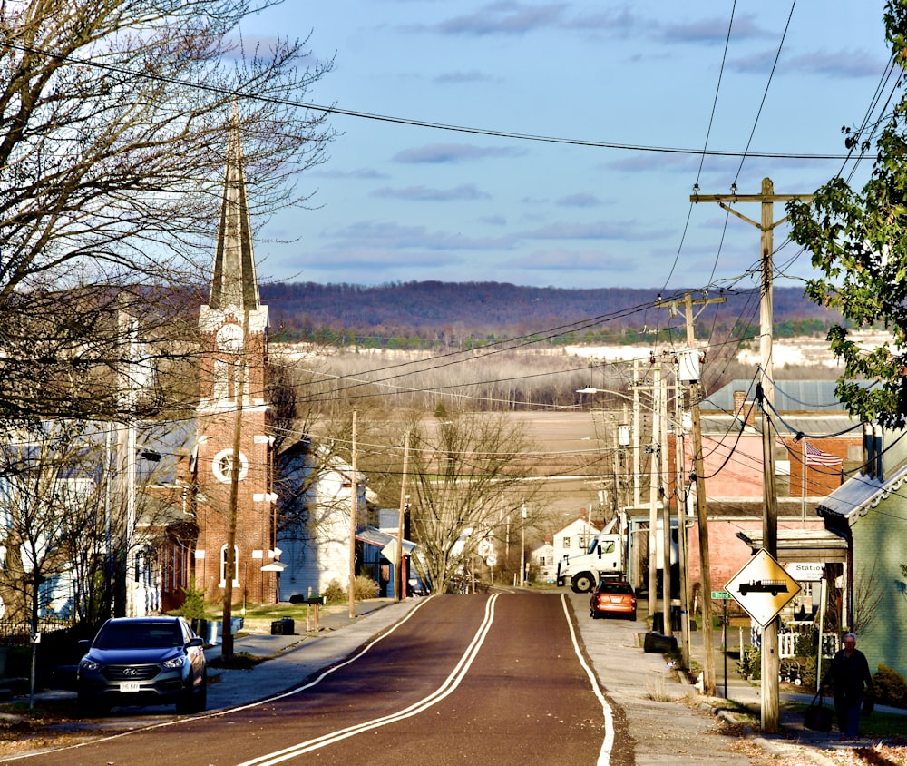 a road with cars and buildings along it