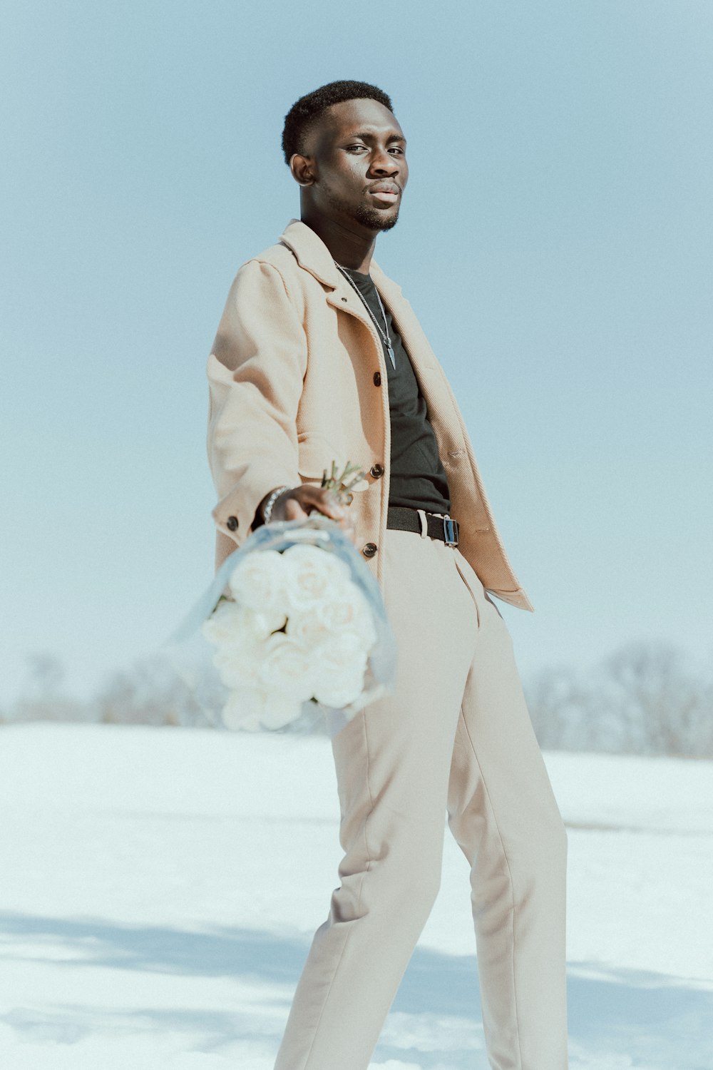 a man holding a snowball