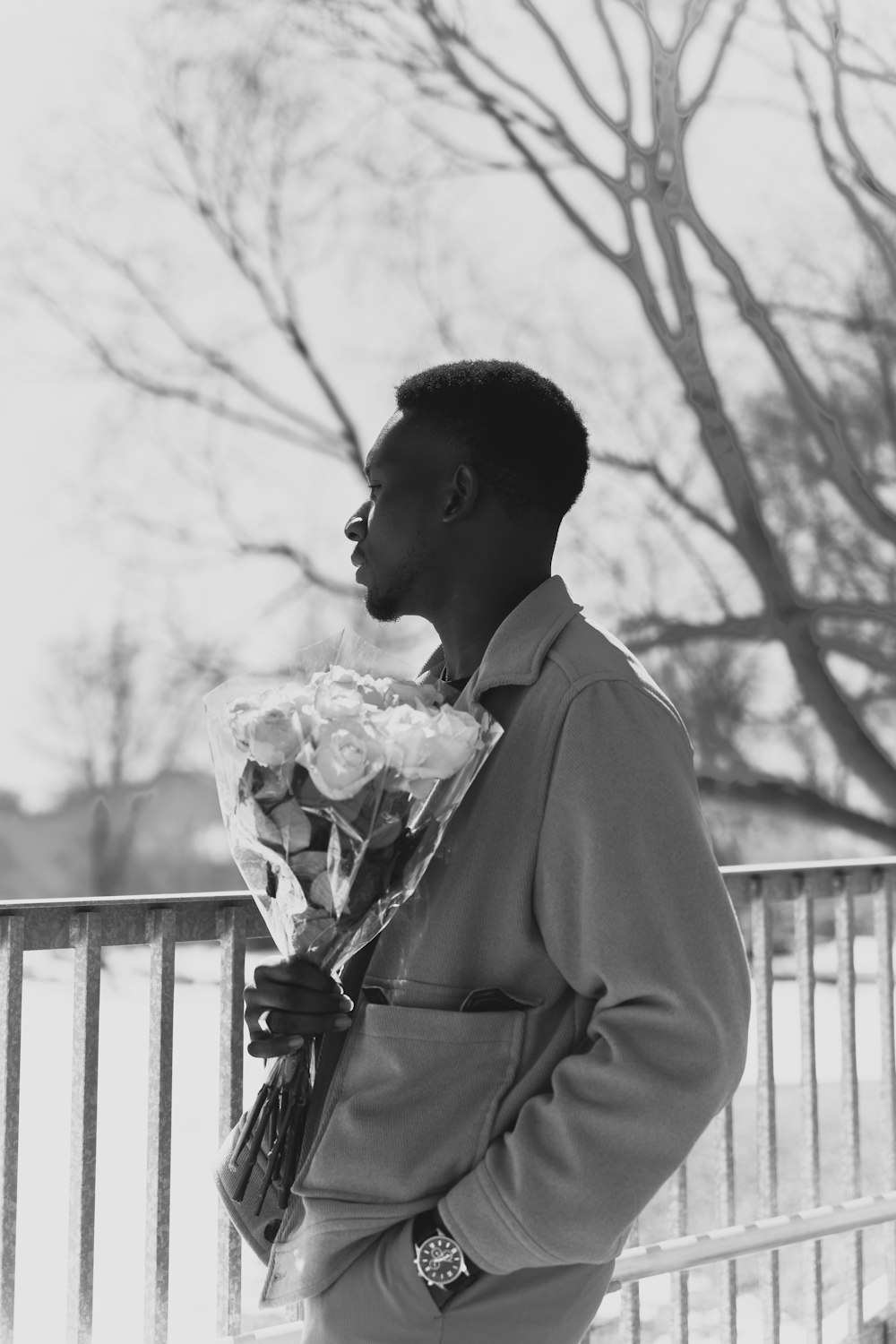 a man holding flowers