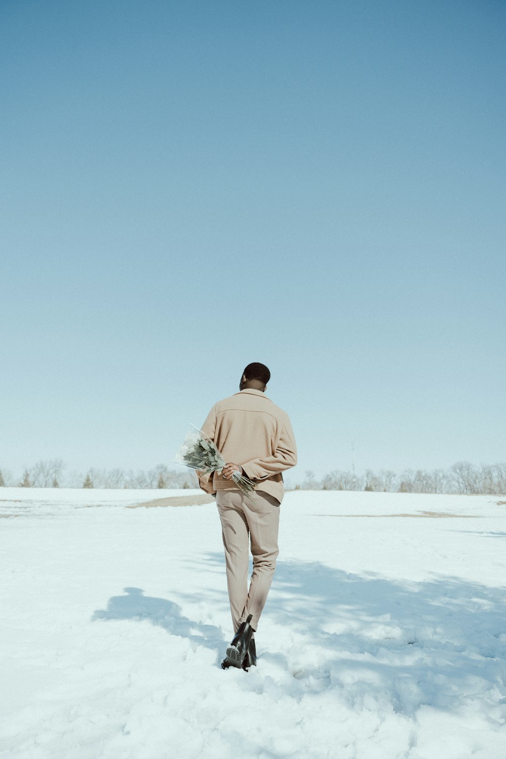 a man walking in the snow