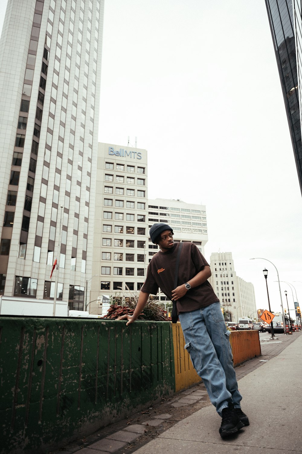 a man leaning on a fence