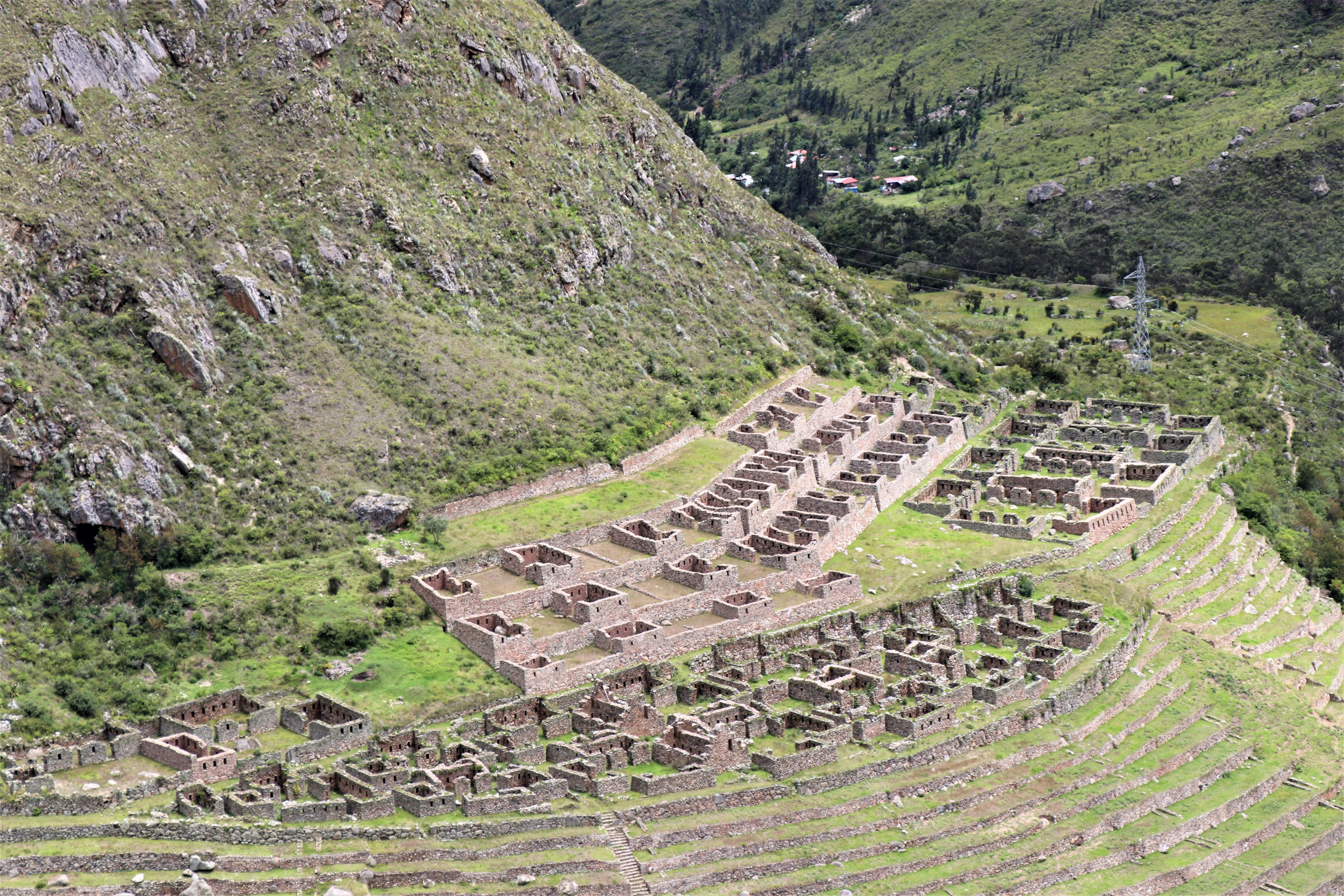 a large stone wall in a mountainous region