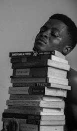 a person with a mustache and books