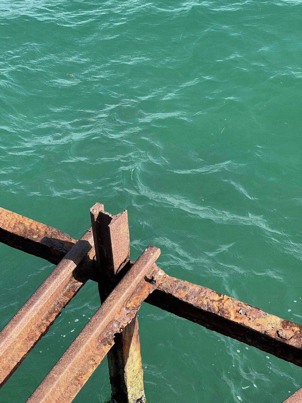 a wooden railing over a body of water