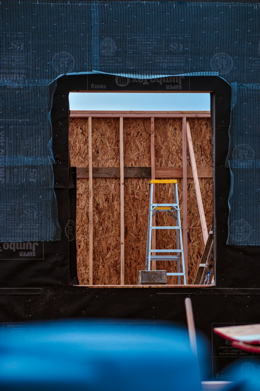 a wooden box with a ladder