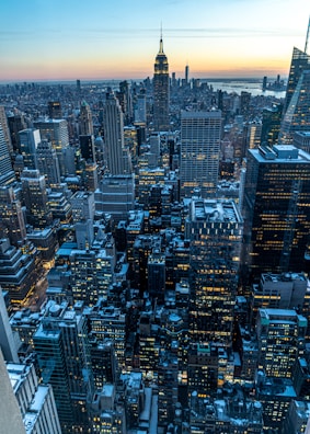 A bustling New York City skyline at dusk, highlighting the VIP USA office.