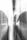 Two skeletal figures appear with a ghostly, ethereal quality, as if they are illuminated or partly transparent. The image has a surreal, dreamlike atmosphere with beams of light passing through the scene, creating a sense of motion or otherworldliness.