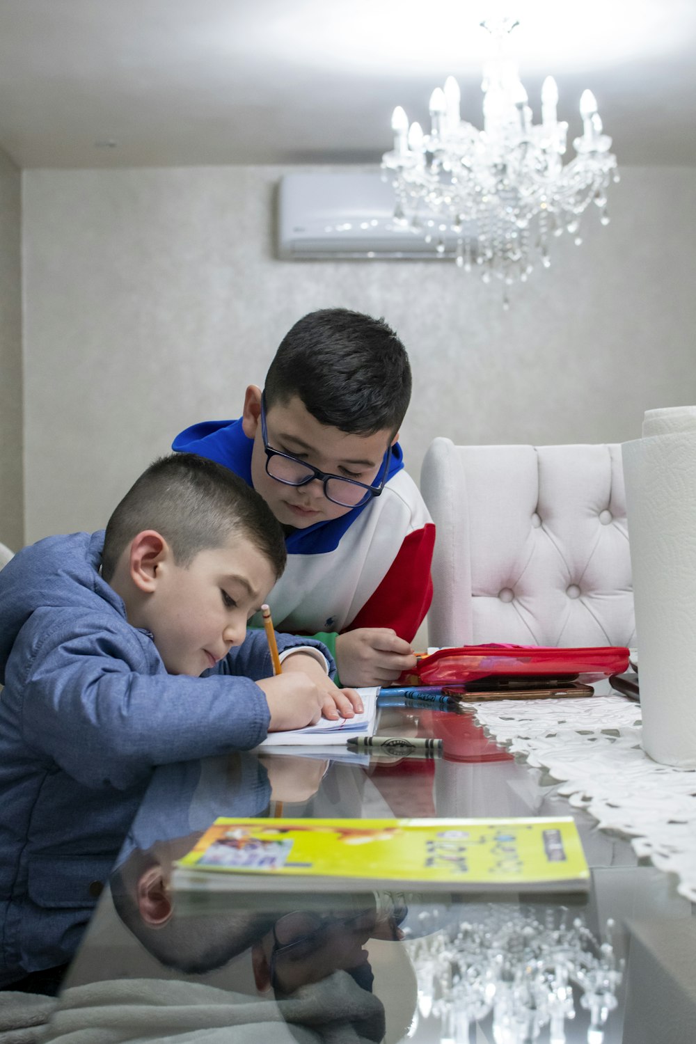 a man and a boy playing a board game on a table