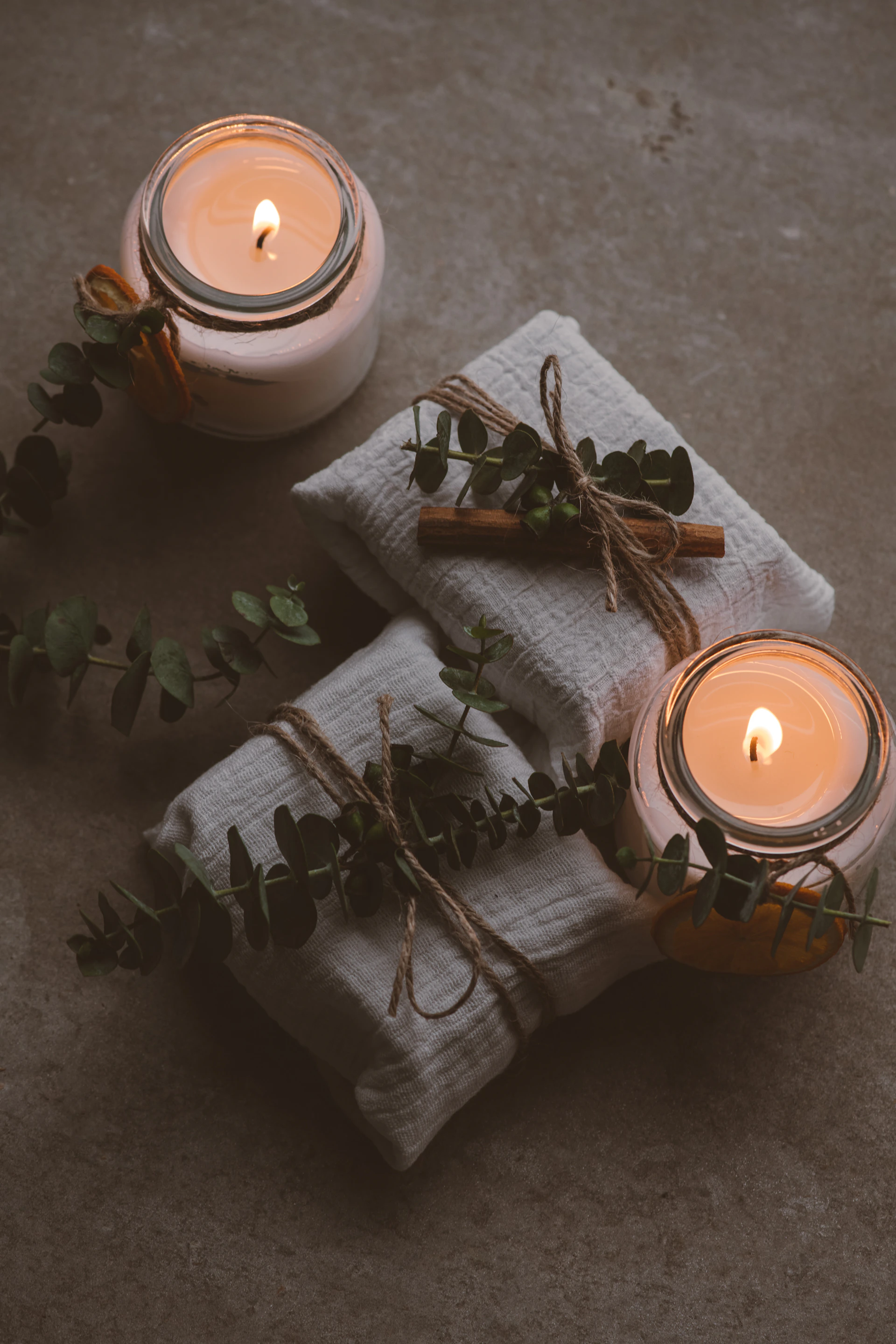 a candle and a pot of flowers
