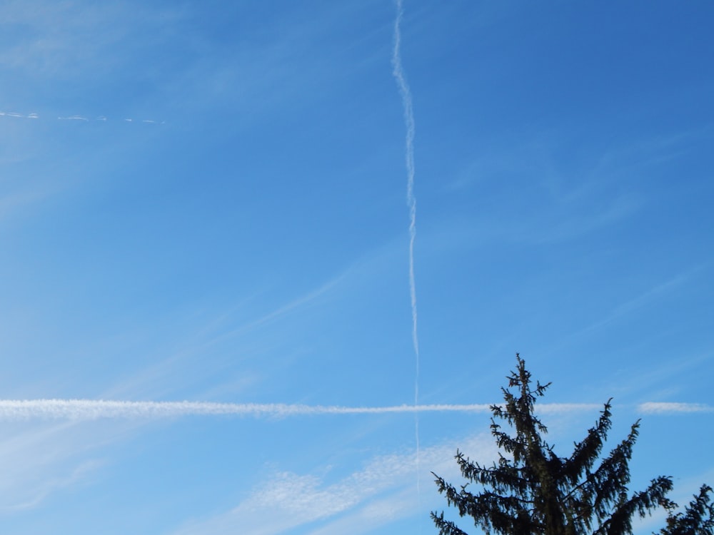 a blue sky with jet streams