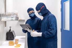 a couple of people wearing masks and gloves and gloves