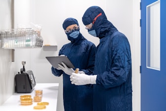 a couple of people wearing masks and gloves and gloves