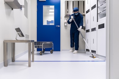 a person in commercial cleaning gear professionally cleaning a medical office