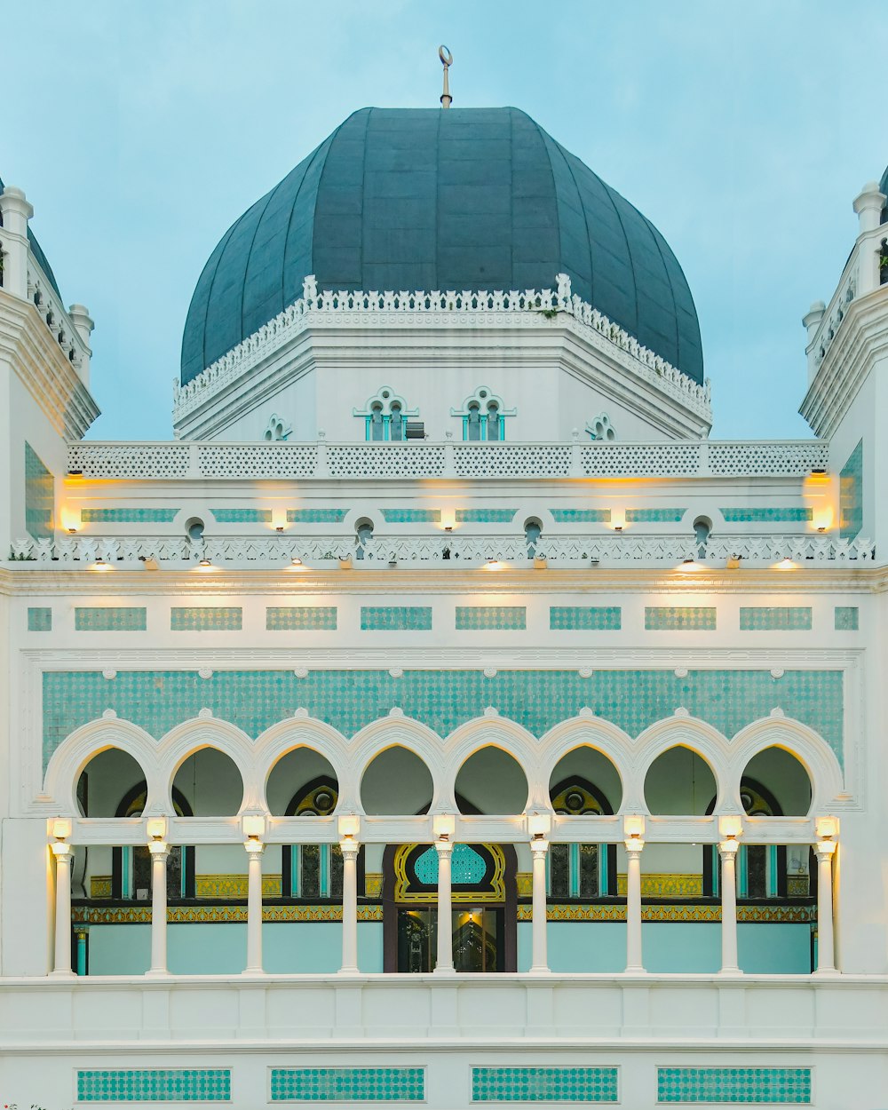 a large white building with a dome