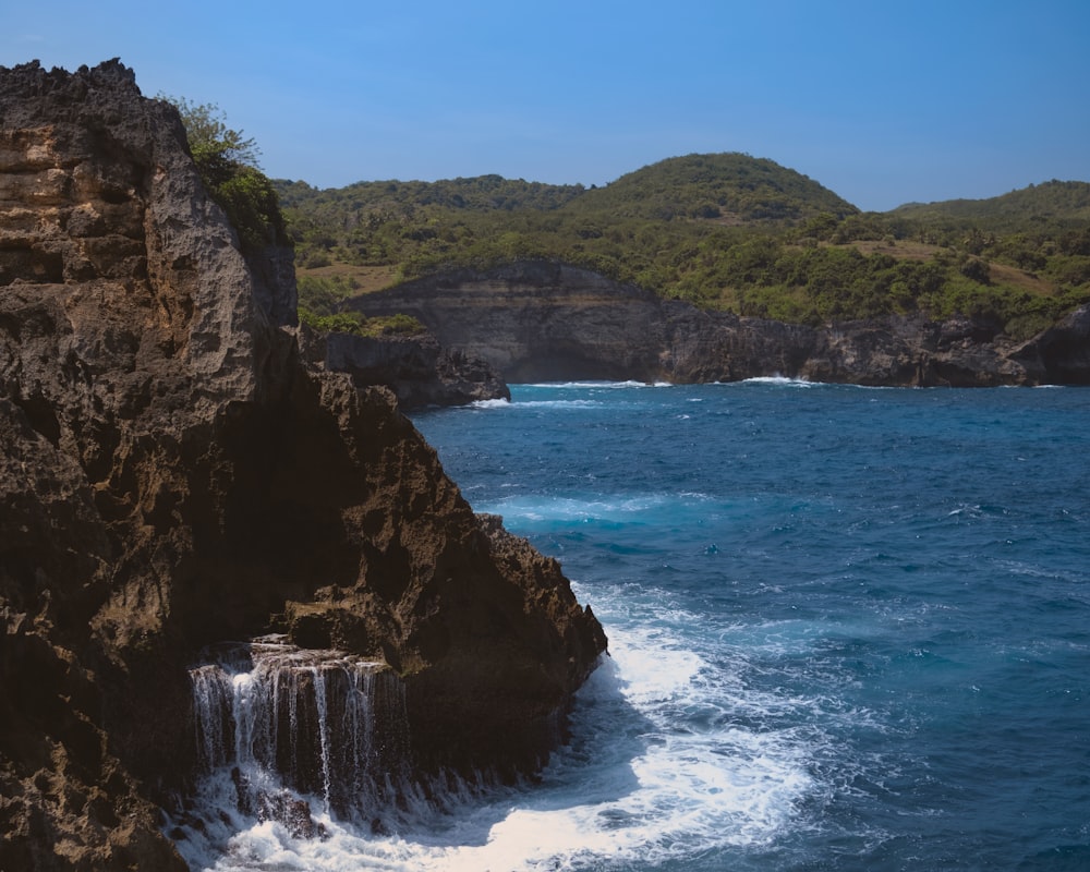 a cliff next to the ocean