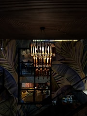 An image of a chandelier installation in a home.