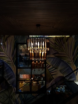 An image of a chandelier installation in a home.
