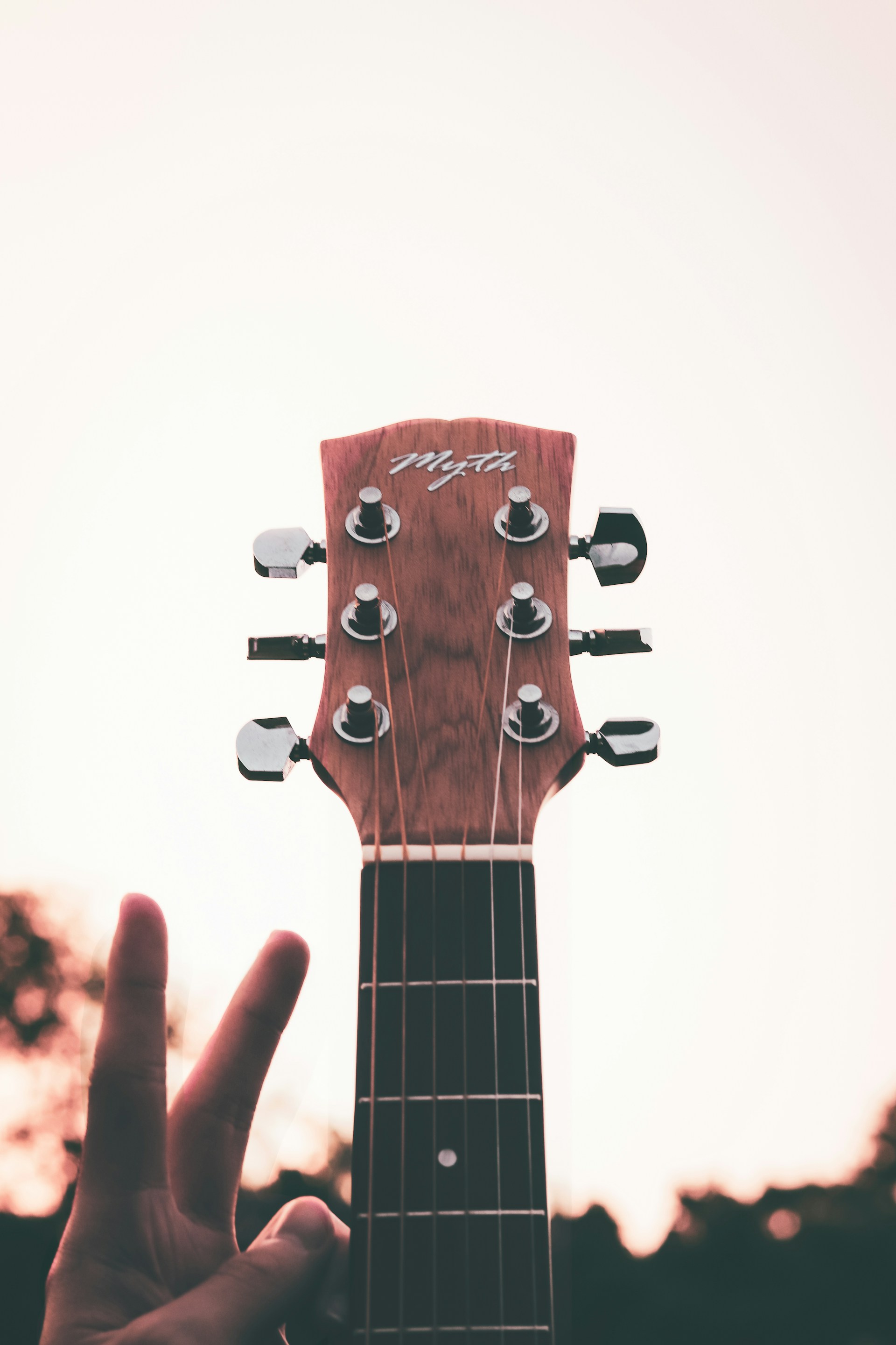 a person holding a guitar