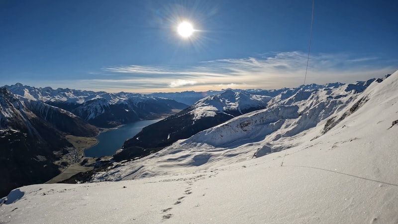 Person holding a wine glass with mountain panorama in South Tyrol