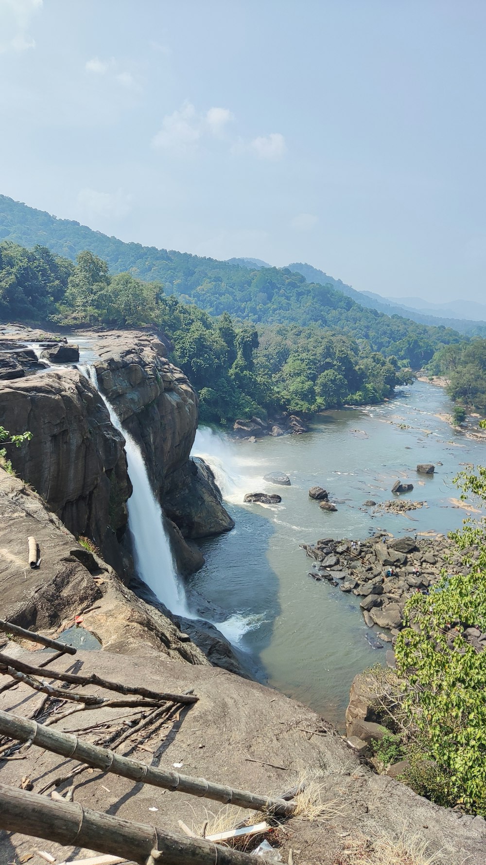 a waterfall over a rocky cliff