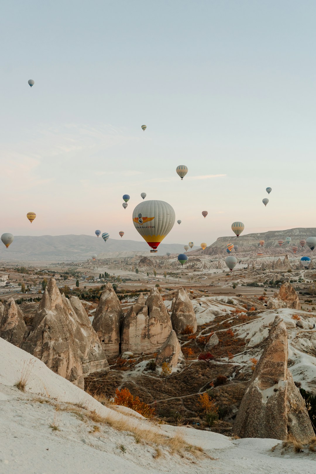 Cappadocia - The fairy chimneys and rock-cut dwellings of Cappadocia glowing in the soft light of a July sunrise.