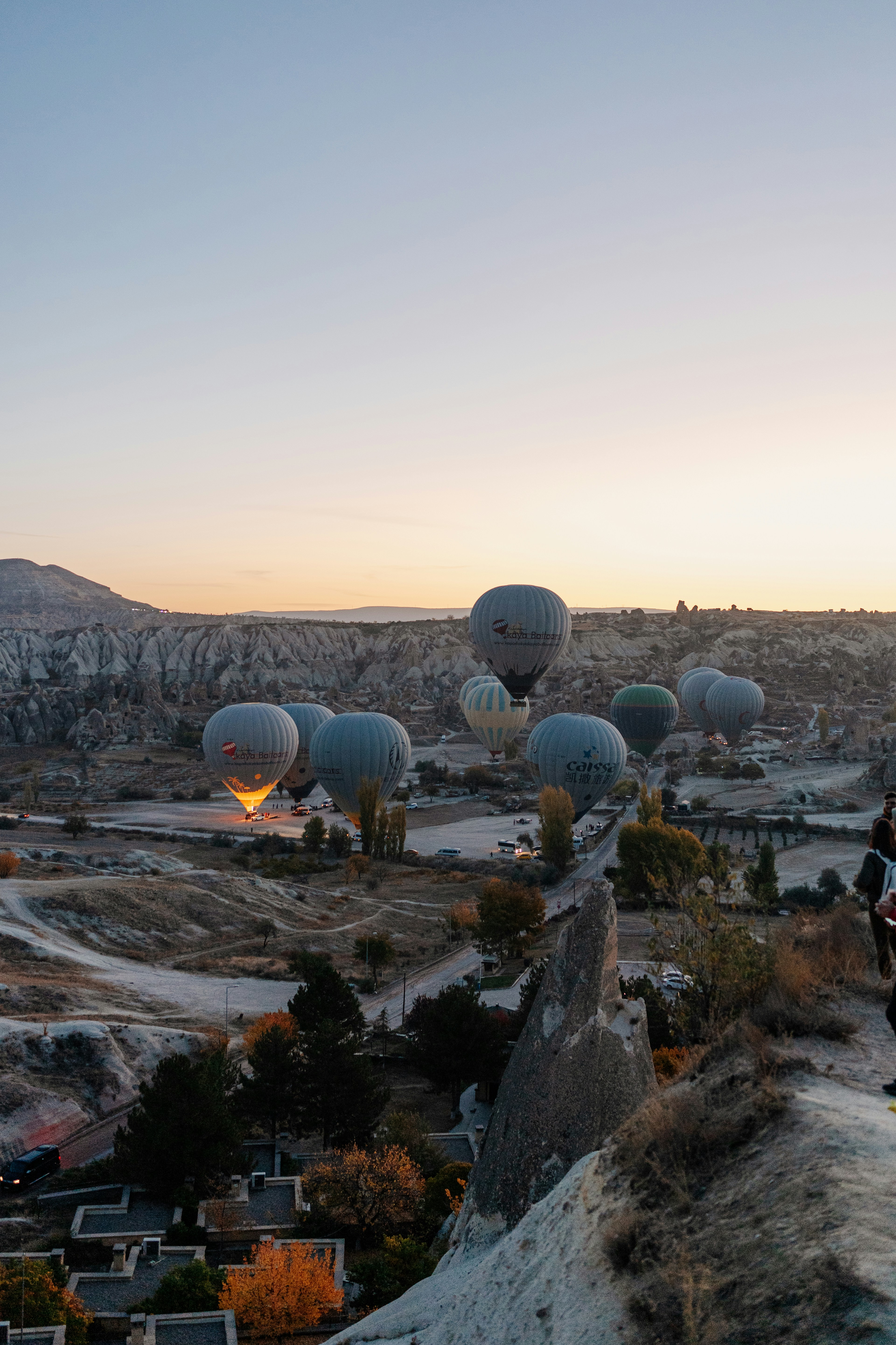 a group of large white and black satellites on a hill