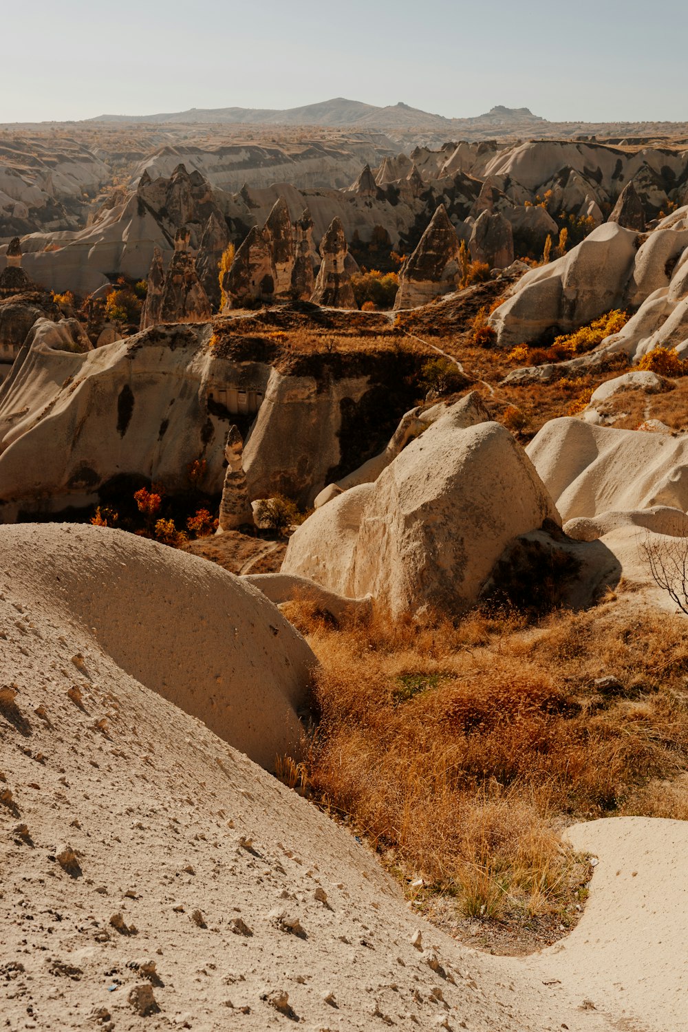 a rocky canyon with a fire