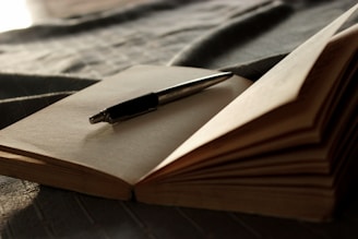 a pen on a book